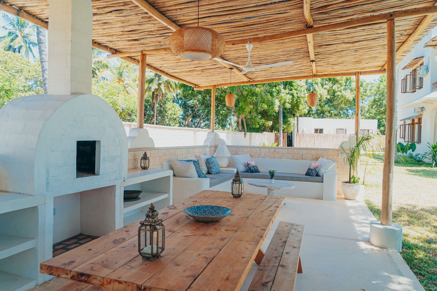 Covered outdoor kitchen with a built-in pizza oven