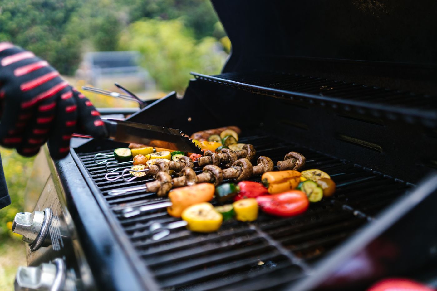 Vegetable skewers cooking on a gas BBQ