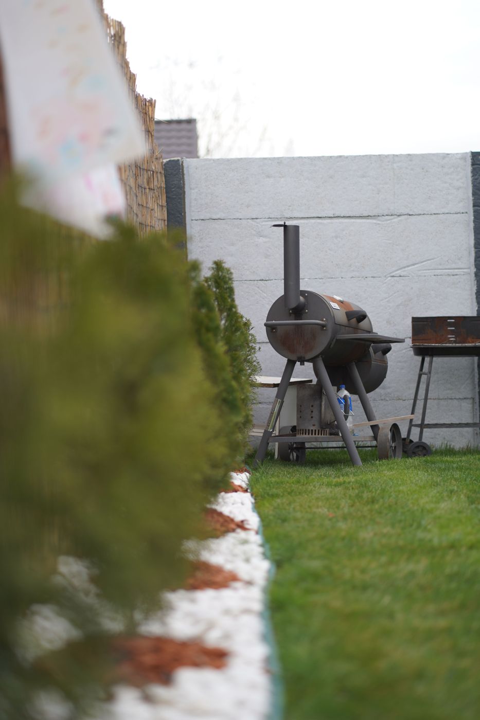 Offset smoker in a garden