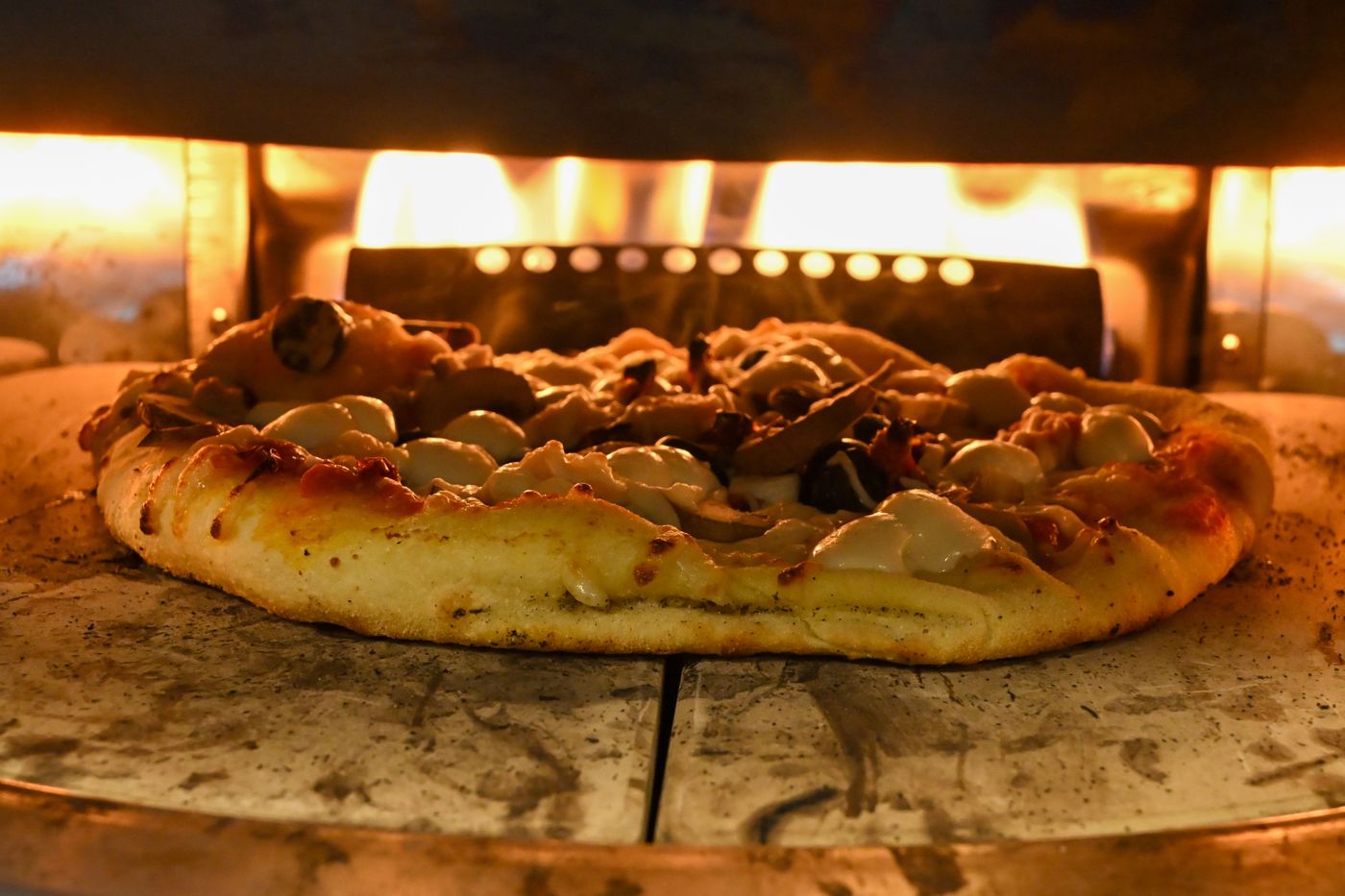 Pizza cooking in a gas pizza oven